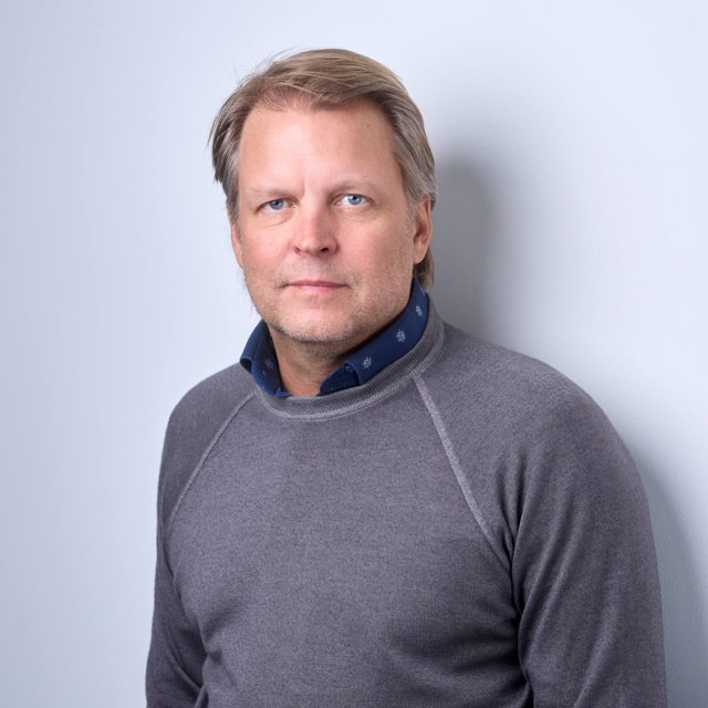 Man in a dark suit (Ville Tamminen, member of the Executive Management Team of Assemblin Caverion Group)