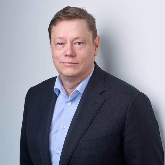 Man in a dark suit (Mikael Aro, member of the Board of Directors of Assemblin Caverion Group)